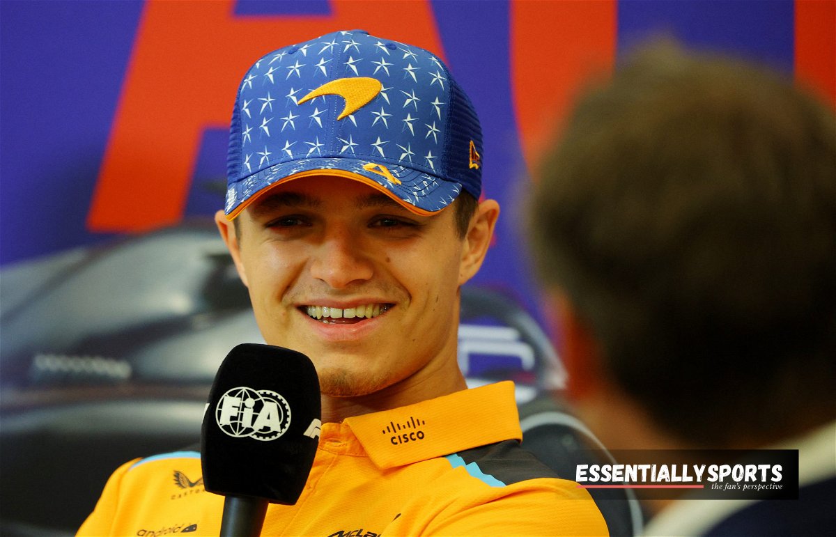 lando norris left shocked as fan thrashes teams color at his face.jpg